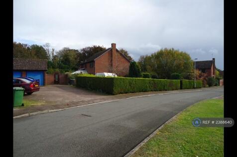 Shows Road And Large Private Driveway