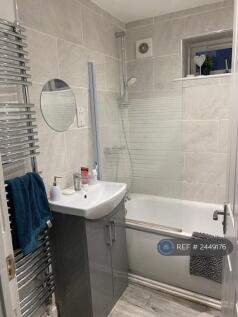 Bathroom 2 Includes a Toilet, Shower, And Bathtub.
