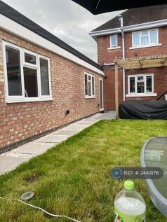 The Back Garden Features a Pergola 