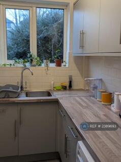 Kitchen With View Of Patio And Back Garden