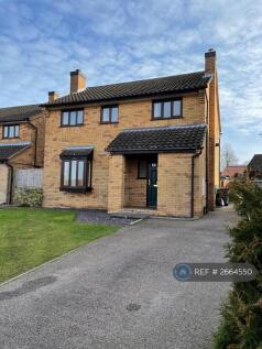 Front View Drive Leading To Double Garage 