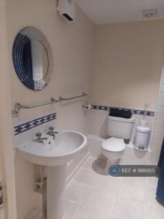 Bathroom Shared Between Blue And Red Room