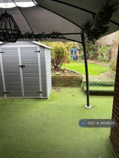 View Of Garden Beside Shed