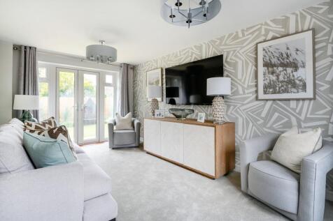 A bright and airy living room with French doors to the garden