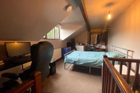A tidy and functional small room with a simple ...