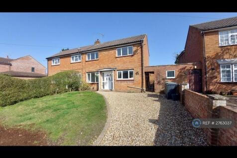 Front Of Property With Large Driveway