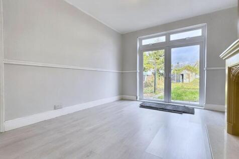 Bright lounge with garden access and fireplace...