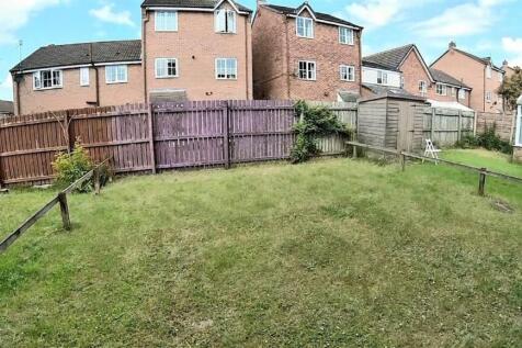 Private rear garden with a level lawn, fenced b...