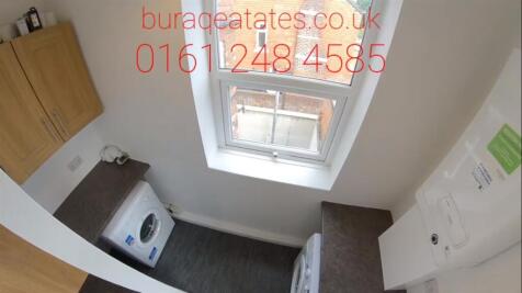 Compact kitchen with a window providing natural...