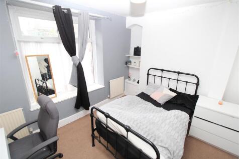 Bright bedroom with stylish bed and study area...
