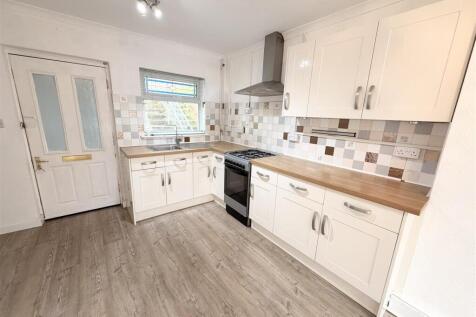 Bright modern kitchen with ample storage space...