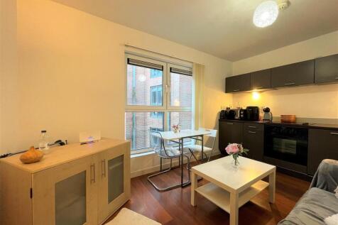 Bright open-plan living area with modern finish...