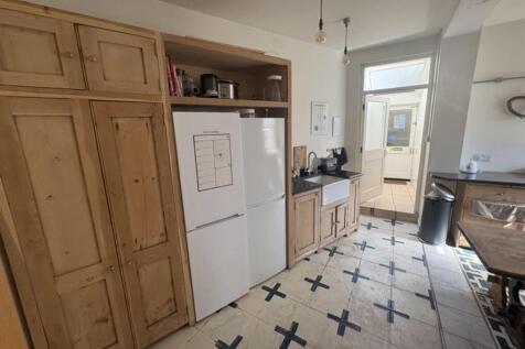 Well-equipped kitchen with storage and natural ...