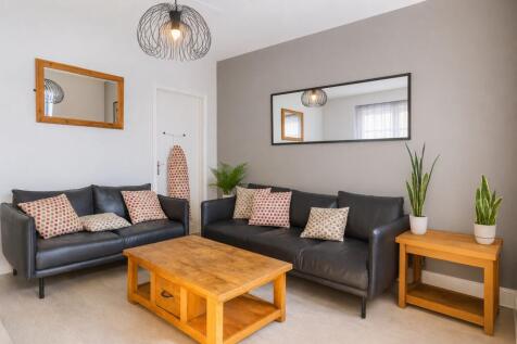 Stylish lounge with sleek leather sofas...