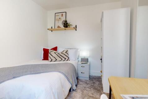 A cozy and well-decorated double bedroom, perfe...