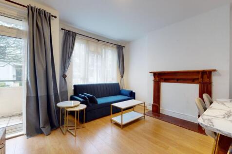 Bright lounge with plush sofa and marble tables...