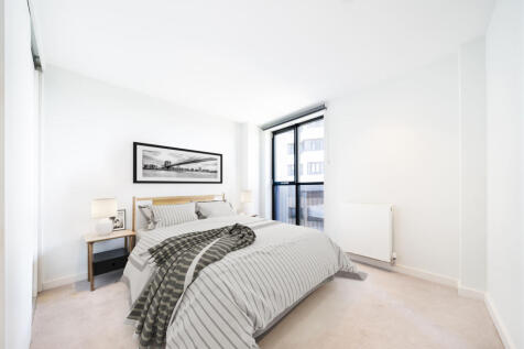 Experience tranquility in this elegantly designed bedroom, featuring abundant natural light.