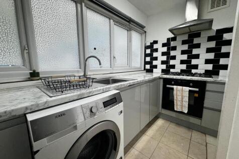 Modern kitchen with stylish monochrome tiling...