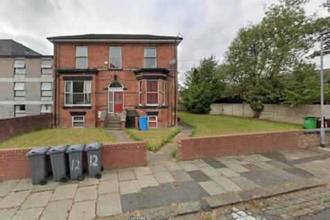 Brick-front semi-detached house with a small fr...
