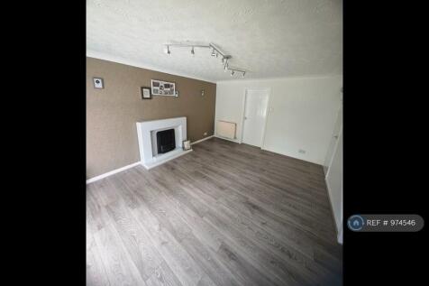 Living Room With Fireplace &amp; Laminate Floor