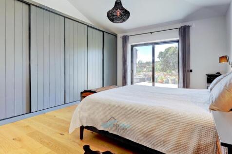 large built in wardrobes with concealed television