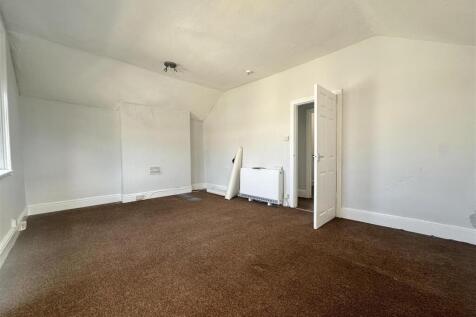 Spacious bright bedroom with high ceilings...