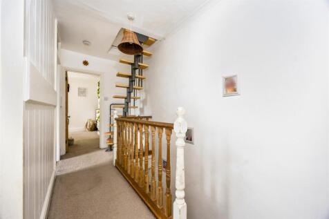 Stairs rising to Second Floor