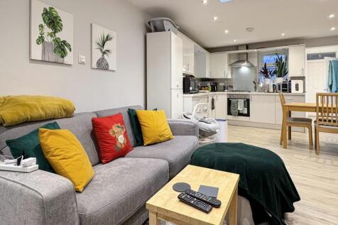 Modern open-plan living area with a comfortable...