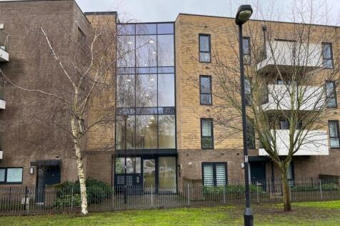 Contemporary brick apartment building with balc...