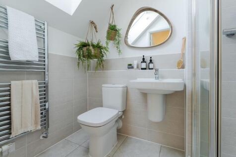 The second floor of this home benefits from a light and airy shower room