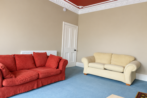 Classic Living Room with Ornate Ceiling Molding