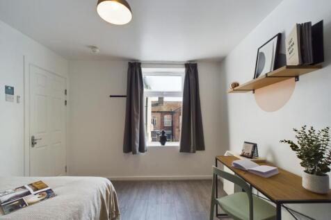 Bright and inviting double bedroom featuring a ...