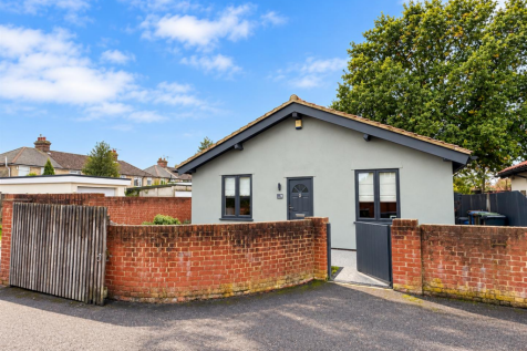 Bright Suburban Bungalow with Curved Brick Wall.pn
