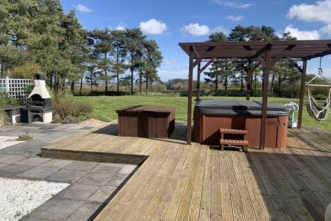 Decked terrace with hot tub