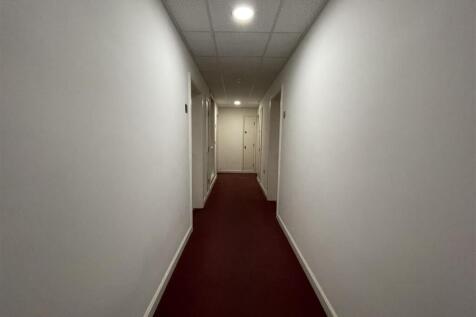 Clean, well-maintained residential hallway...