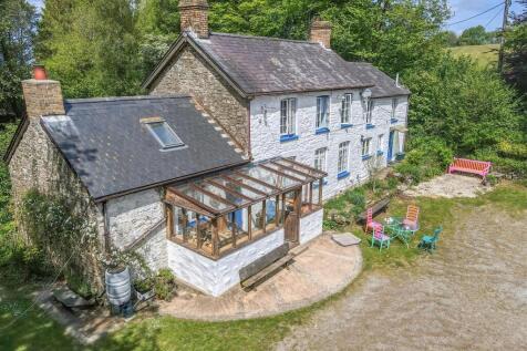 Another view of main house and cottage