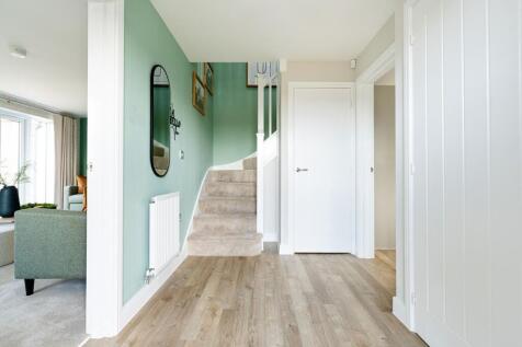 Spacious hallway with under stairs storage