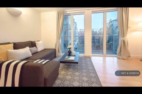Living Room With Laminated Wooden Flooring