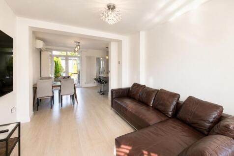 Spacious open-plan living room with sofa...