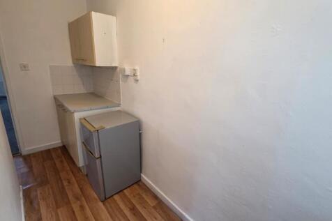 Compact single-wall kitchen corridor with lamin...