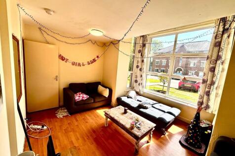 Bright and welcoming living room with large win...