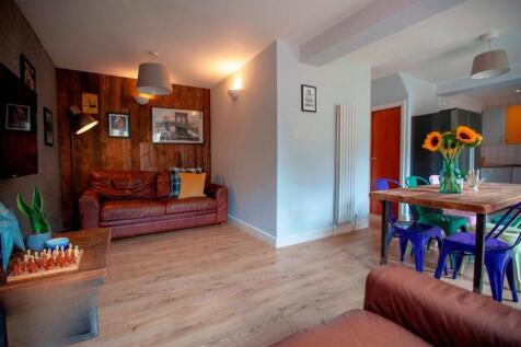 Bright lounge with dining area and wooden floor...