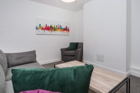 Bright, modern lounge with comfortable seating,...