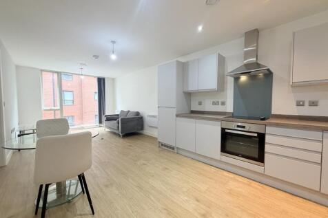 Spacious open-plan living room and fitted kitchen