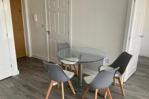 Modern dining area with glass table and stylish...