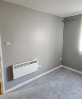 Fresh neutral decor with plush grey carpeting...