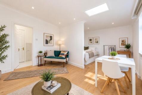 scandinavian studio with cosy green accents.jpg