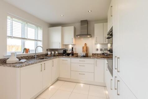 The modern kitchen benefits from ample storage