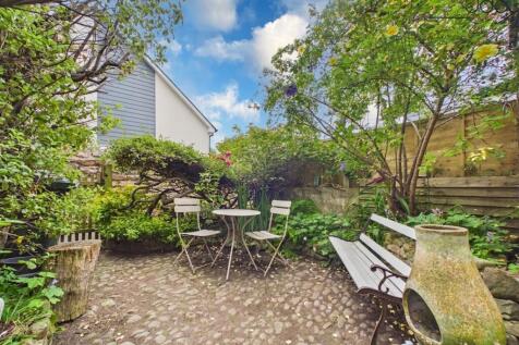 A private cobbled South facing garden