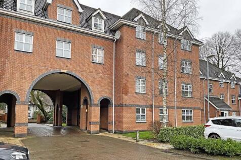 Modern brick apartment with attractive archway...